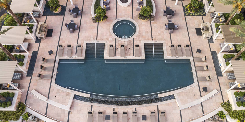 bird-eye's view of high-rise luxury apartment pool