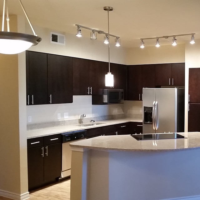 Stainless Steel Appliances Granite Countertops Espresso Cabinets Glass Stovetop Pendant Lighting Wood Floors And Vast Walk In Closets Stainless Steel Appliances Granite Countertops Espresso Cabinets Glass Stovetop Pendant Lighting Wood Floors And Vast Walk In Closets
